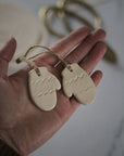 handmade pair of ceramic mitten tree decoration off white 