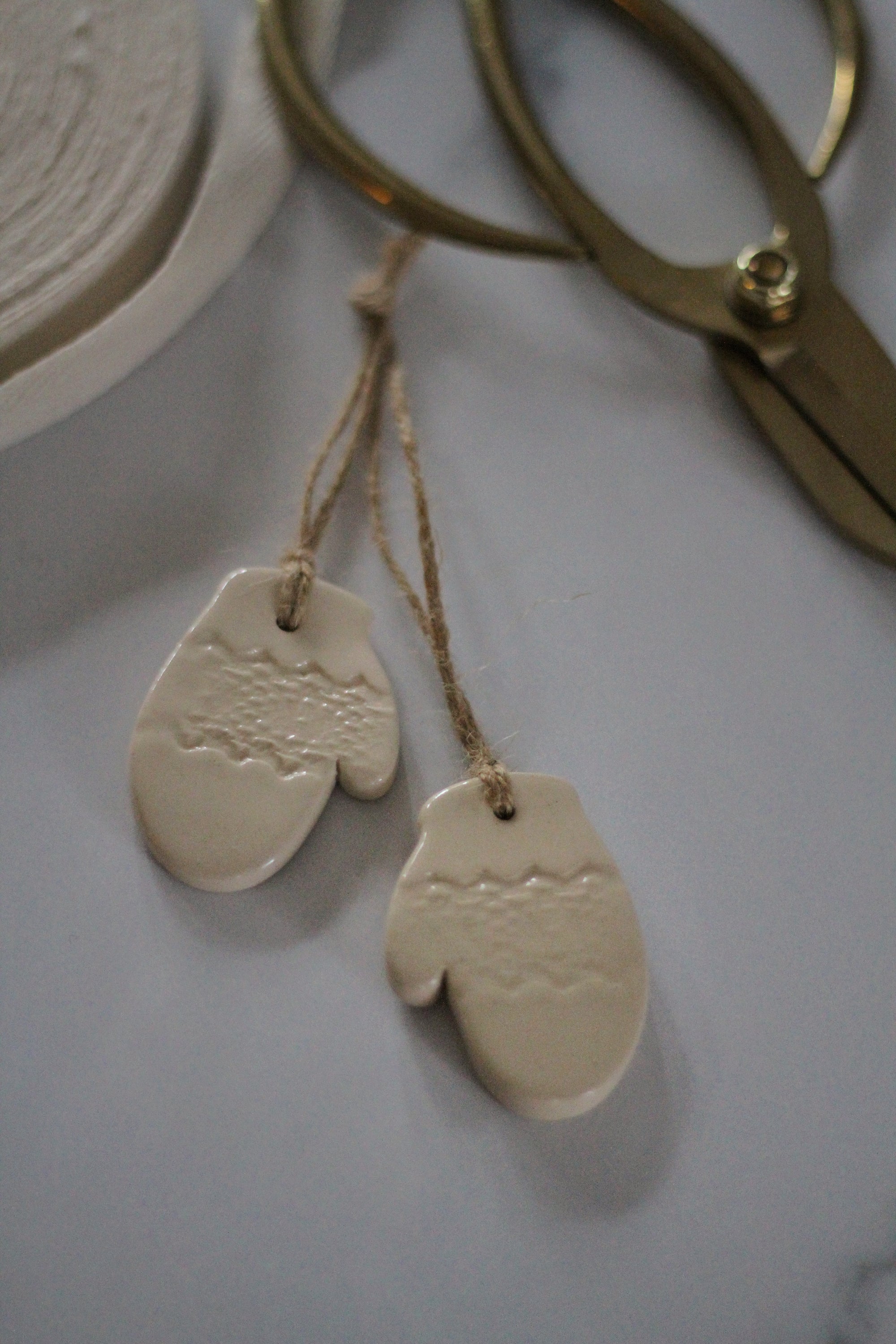 handmade pair of ceramic mitten tree decoration off white 