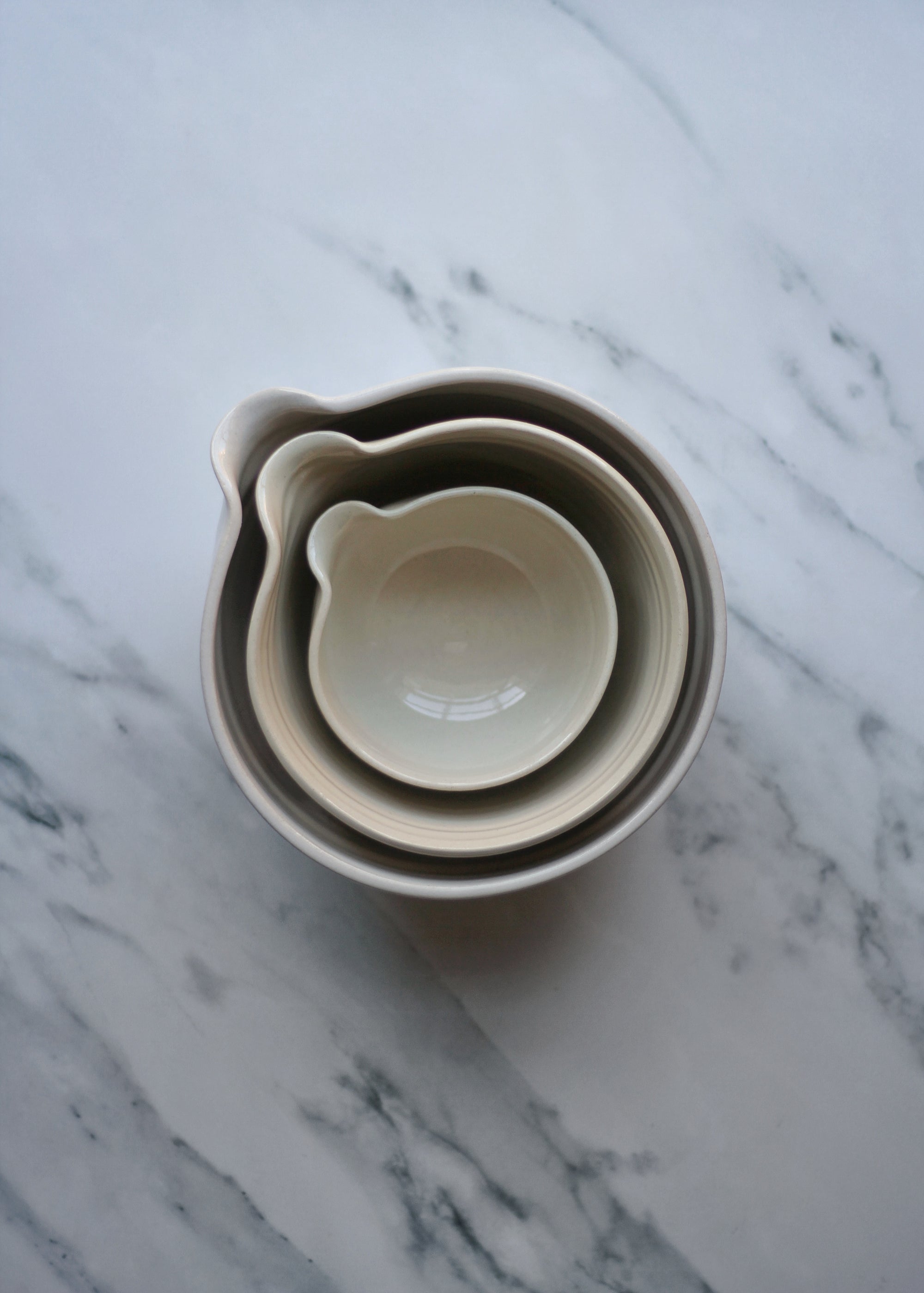 Beige ceramic bowl on a marble surface