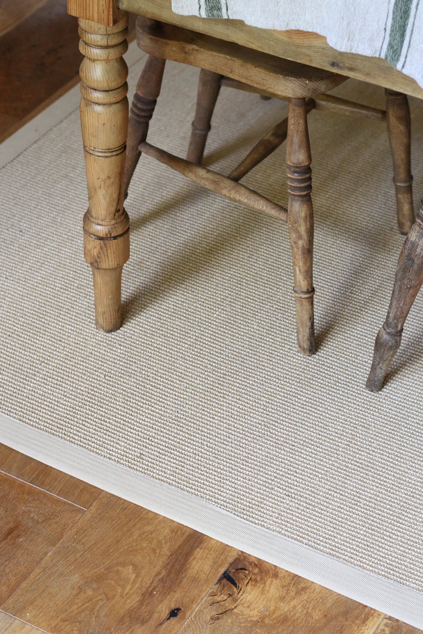 natural sisal rug with a beige cotton border
