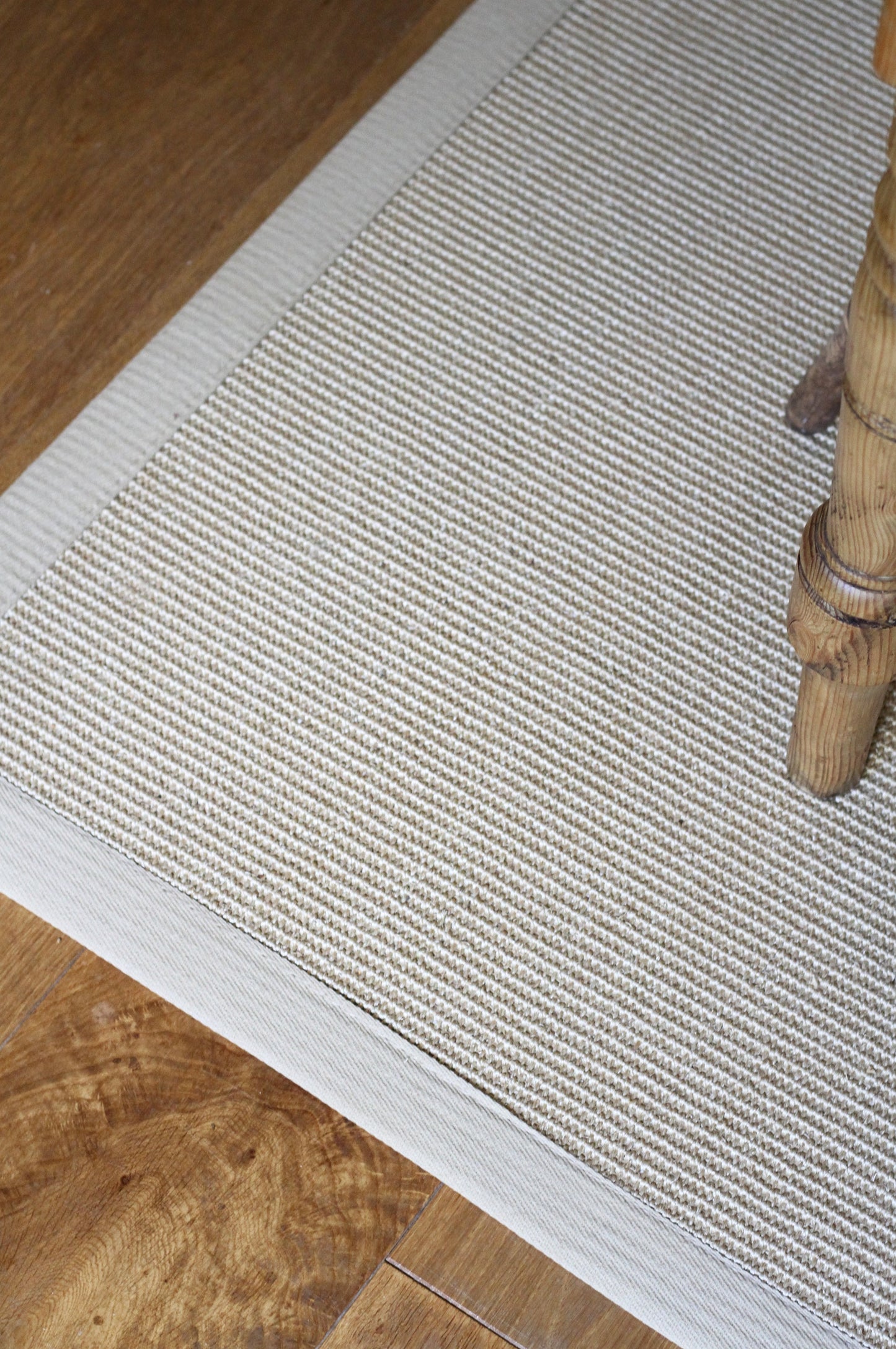 natural sisal rug with a beige cotton border