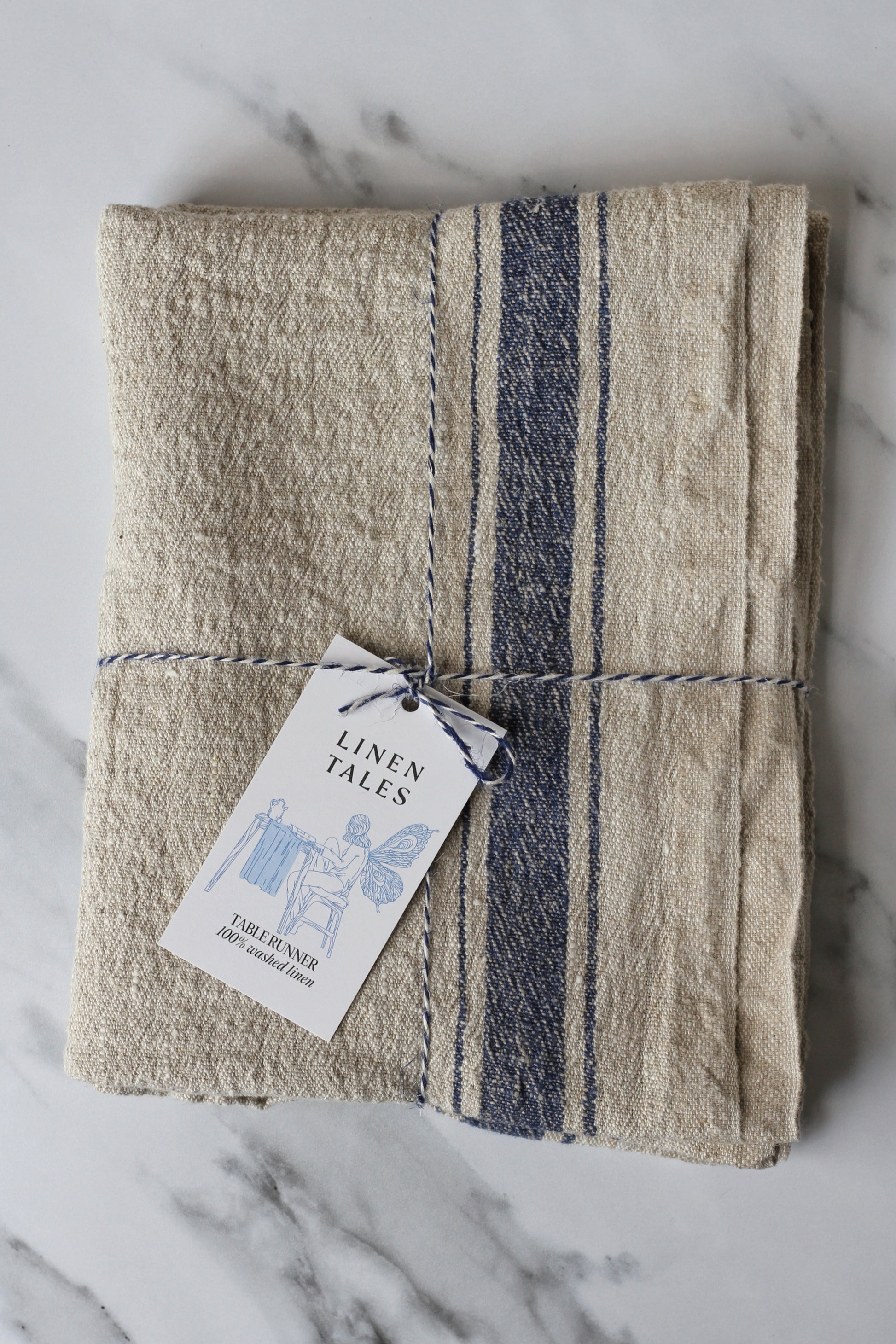rustic beige linen table runner, with a blue stripe. French style.