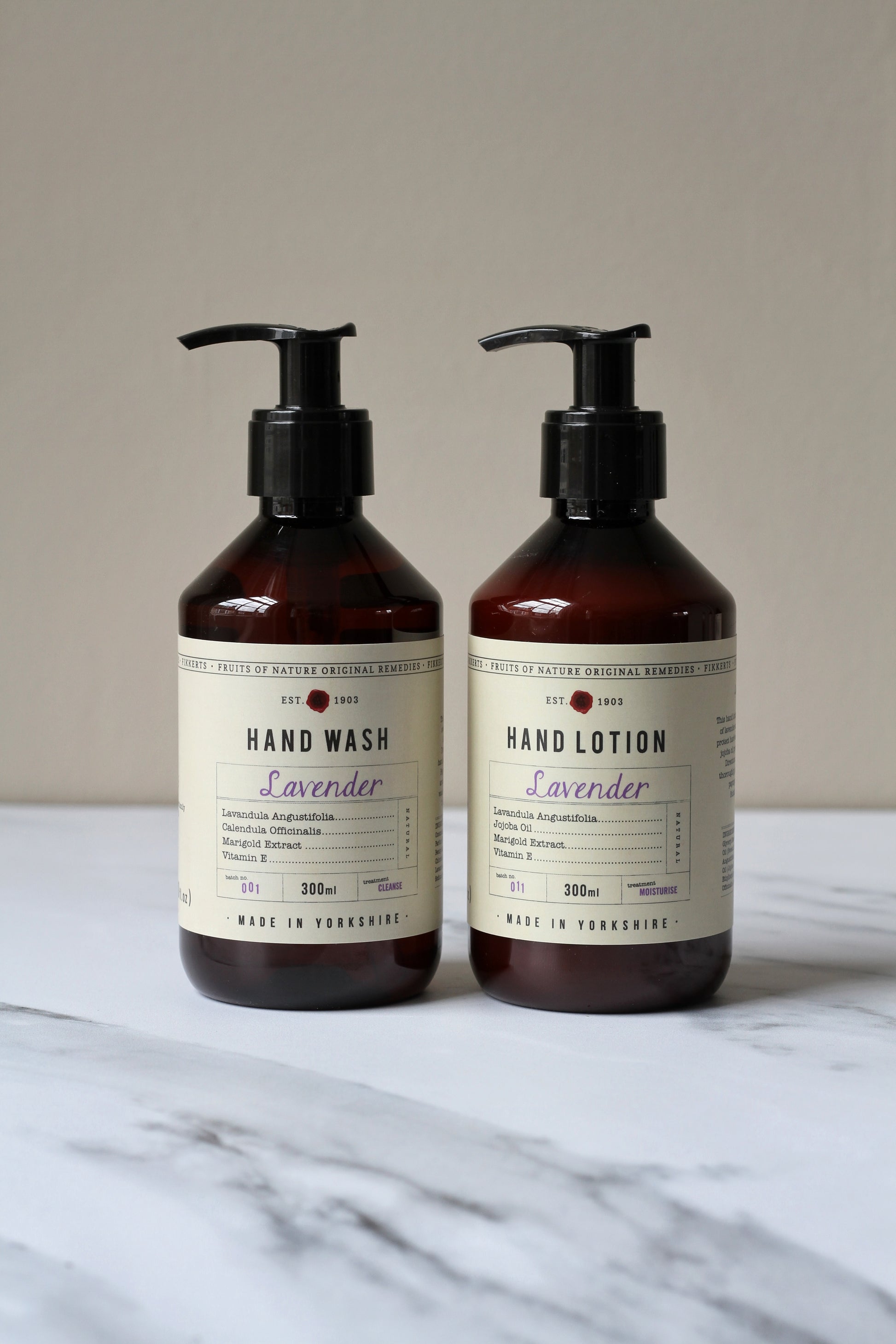 lavender hand wash and hand lotion in amber bottle
