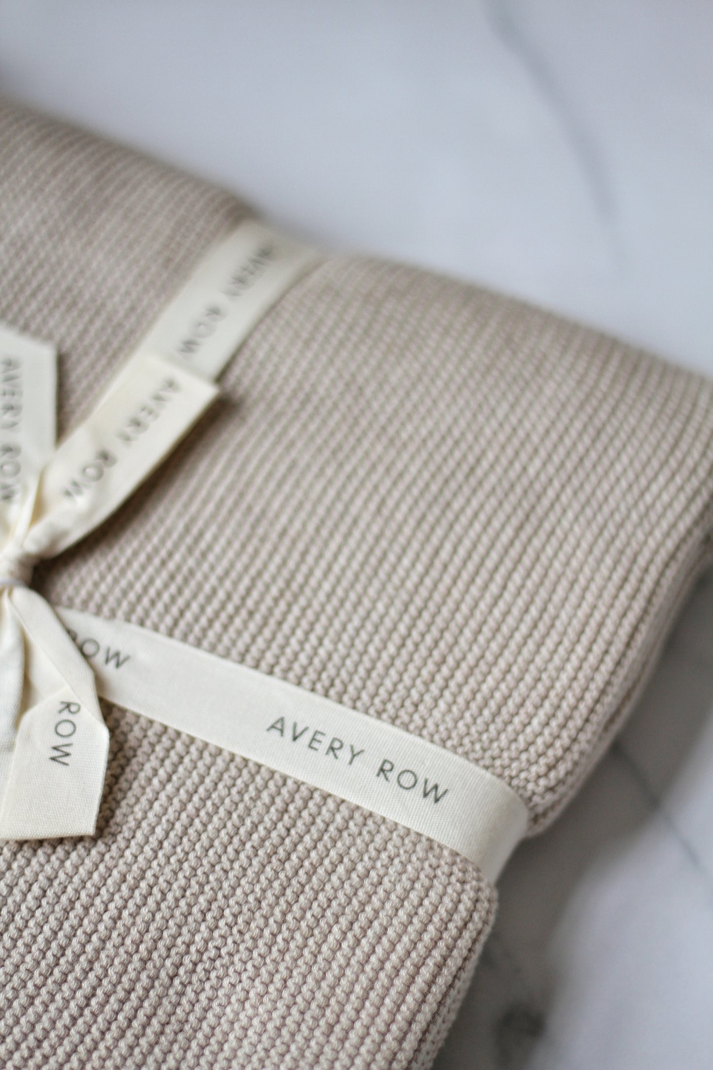 Avery Row Scalloped stone cotton baby blanket