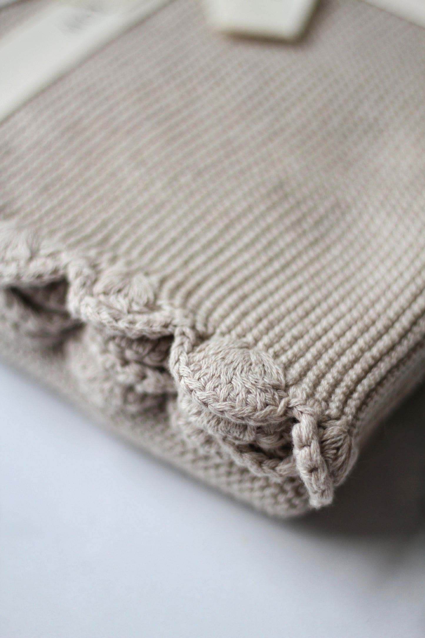 Avery Row Scalloped stone cotton baby blanket
