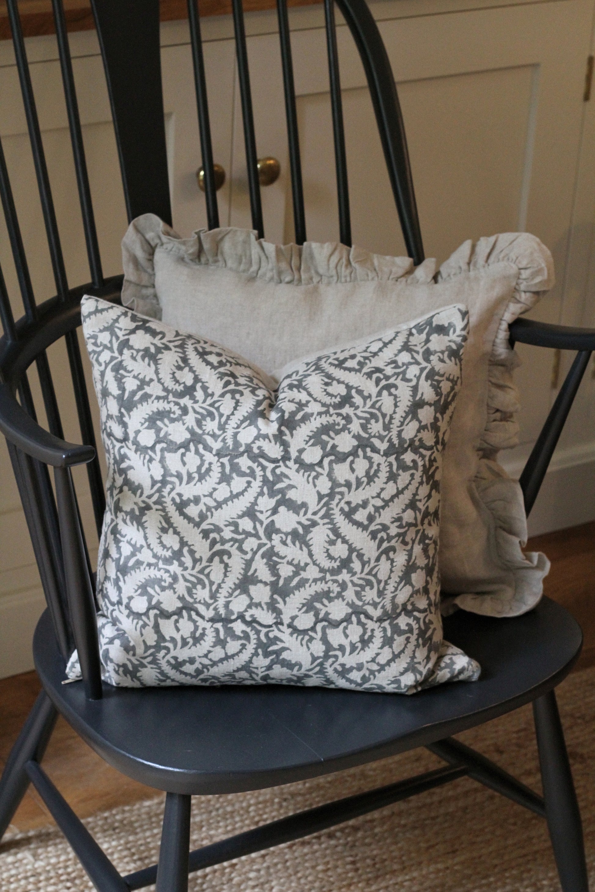 grey floral block printed cushion cover with a natrural colour background, linen. 45cm x 45cm.