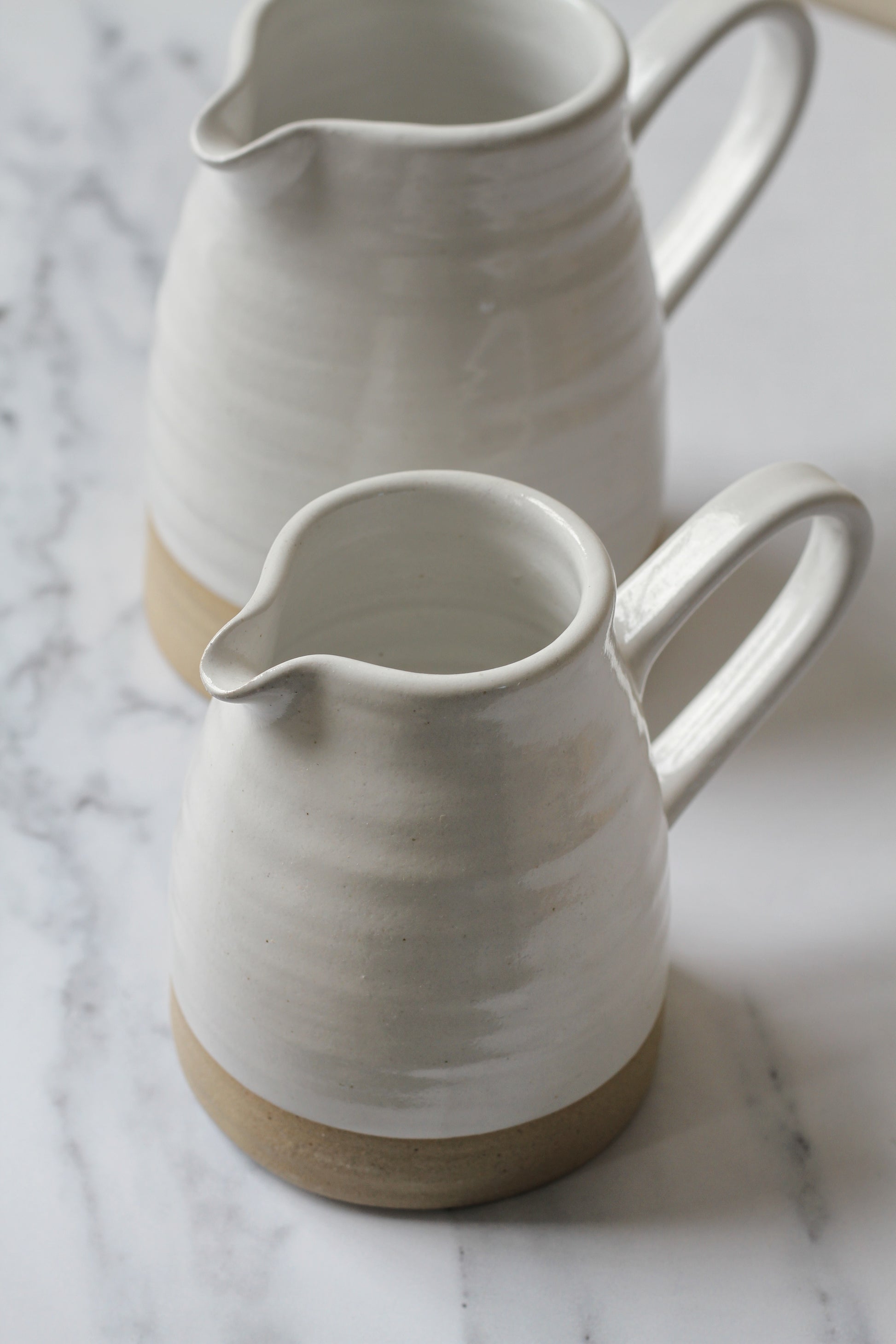 handmade stoneware jug with white glaze made in york by potter philip magson