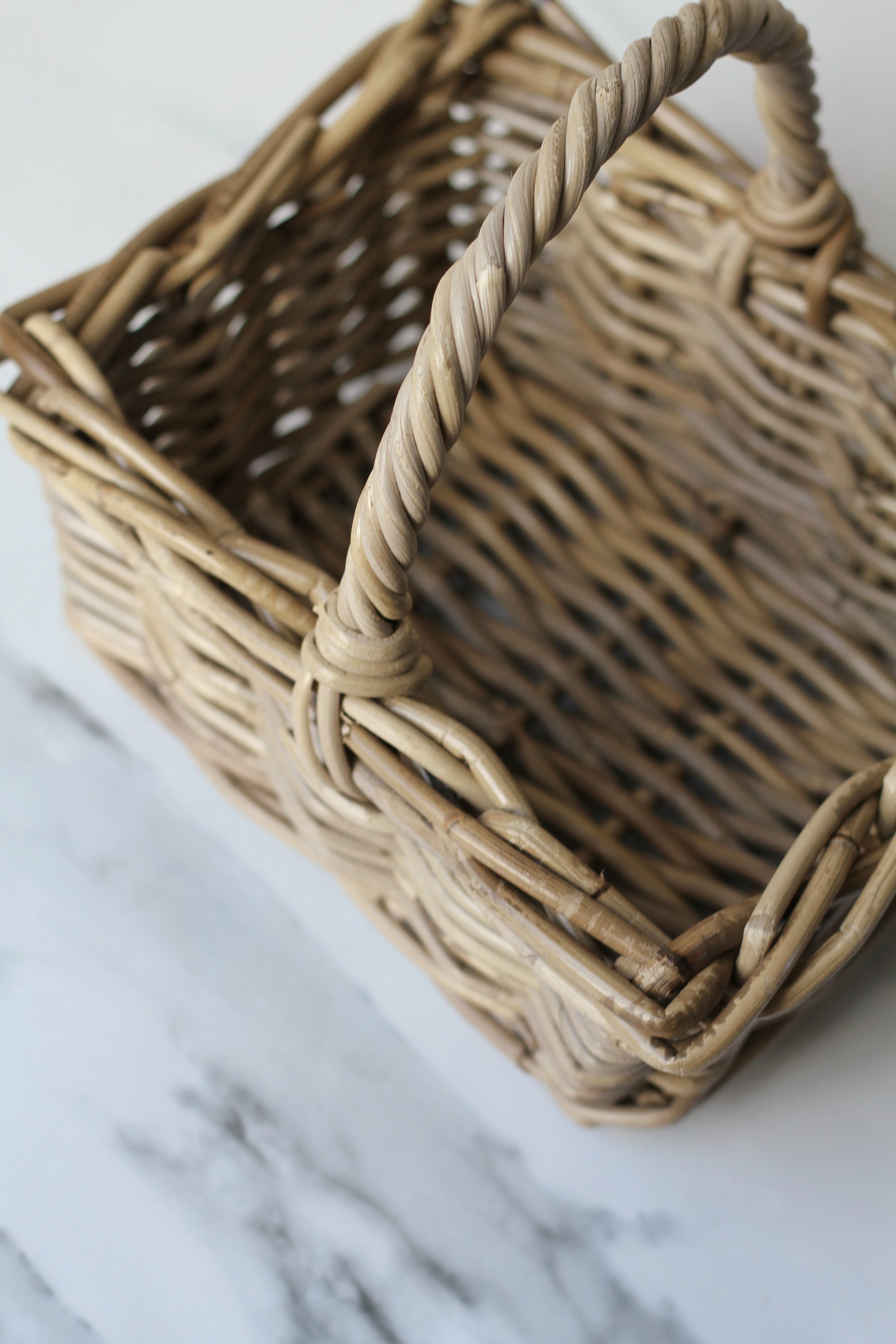 small grey wash rattan basket with handle