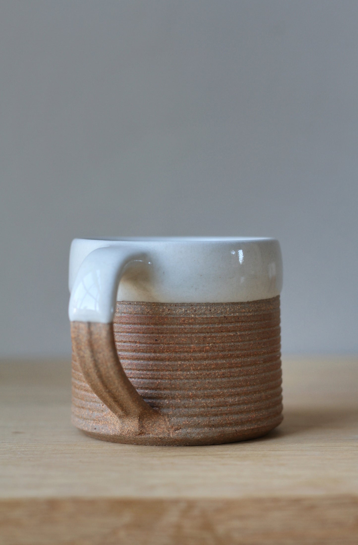 terradotta mug handmade with a white glaze rim