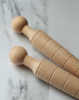 wooden plant dibber for making a hole in the soil