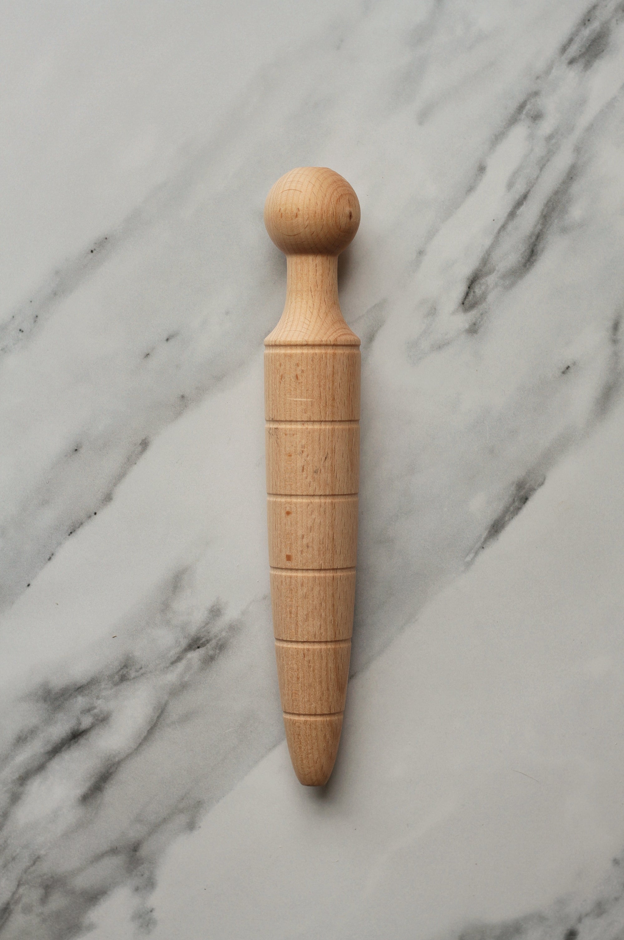 wooden plant dibber for making a hole in the soil