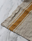 rustic linen tea towel natural linen colour with a mustard yellow stripe