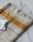 rustic linen tea towel natural linen colour with a mustard yellow stripe