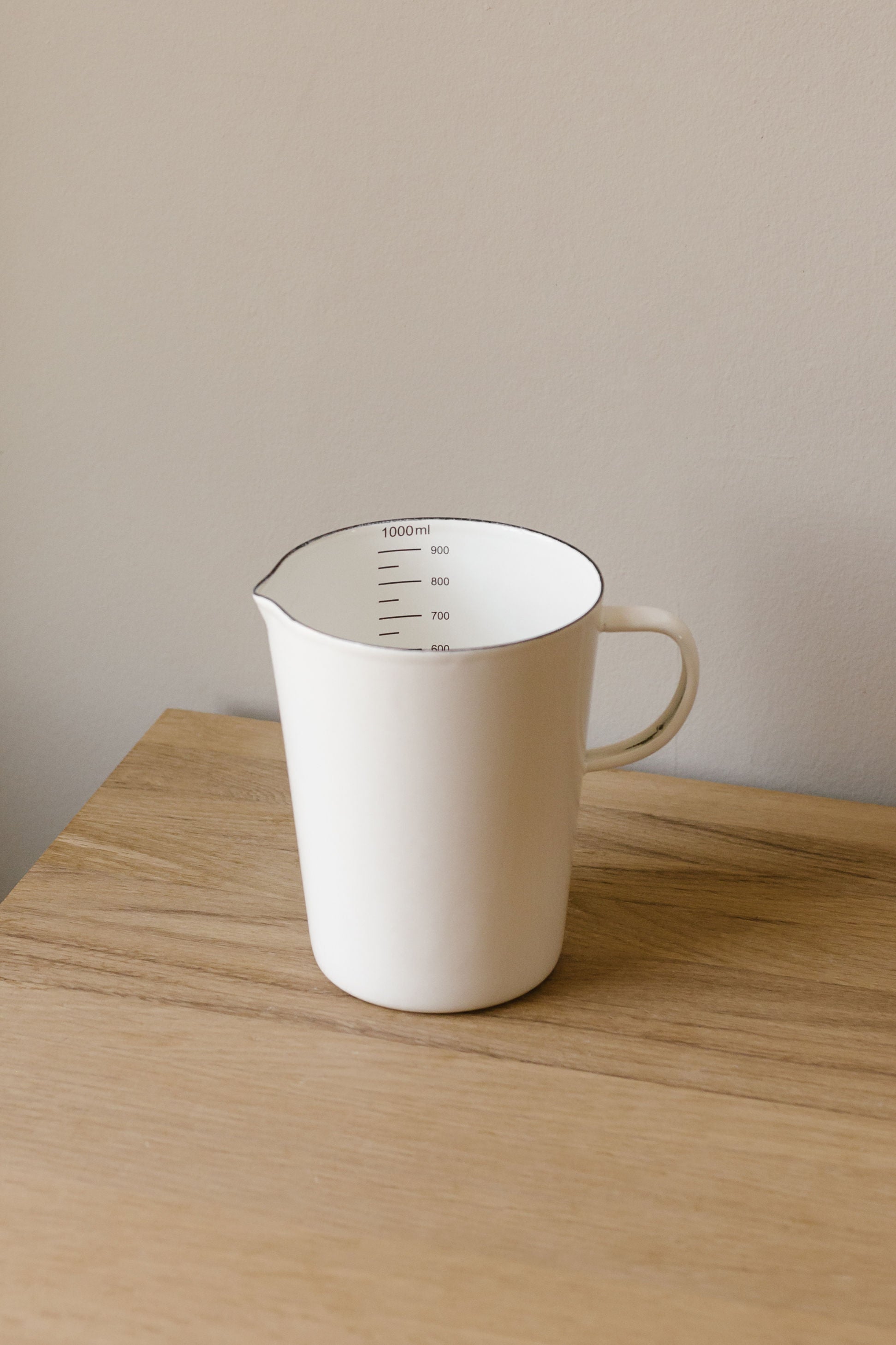 white enamal measuring jug