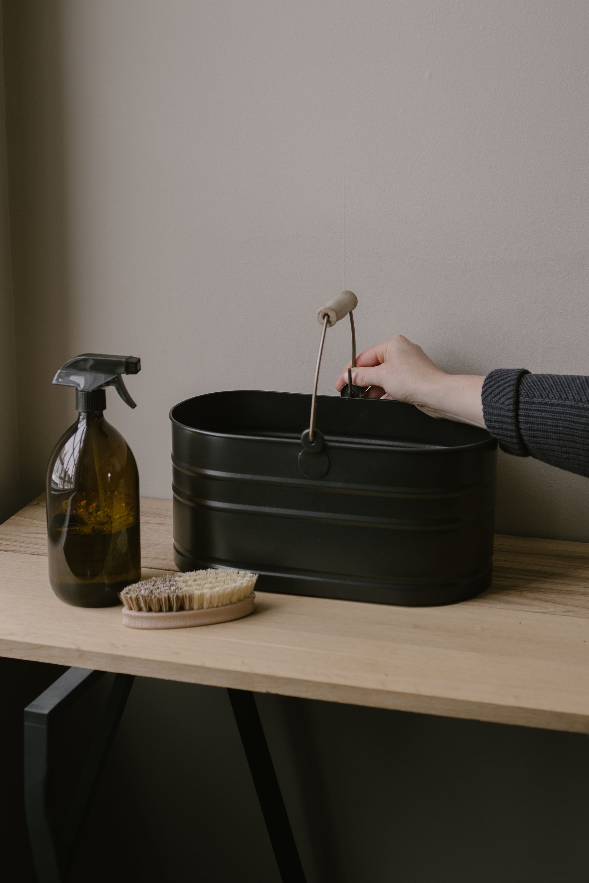 black metal utility storage bucket