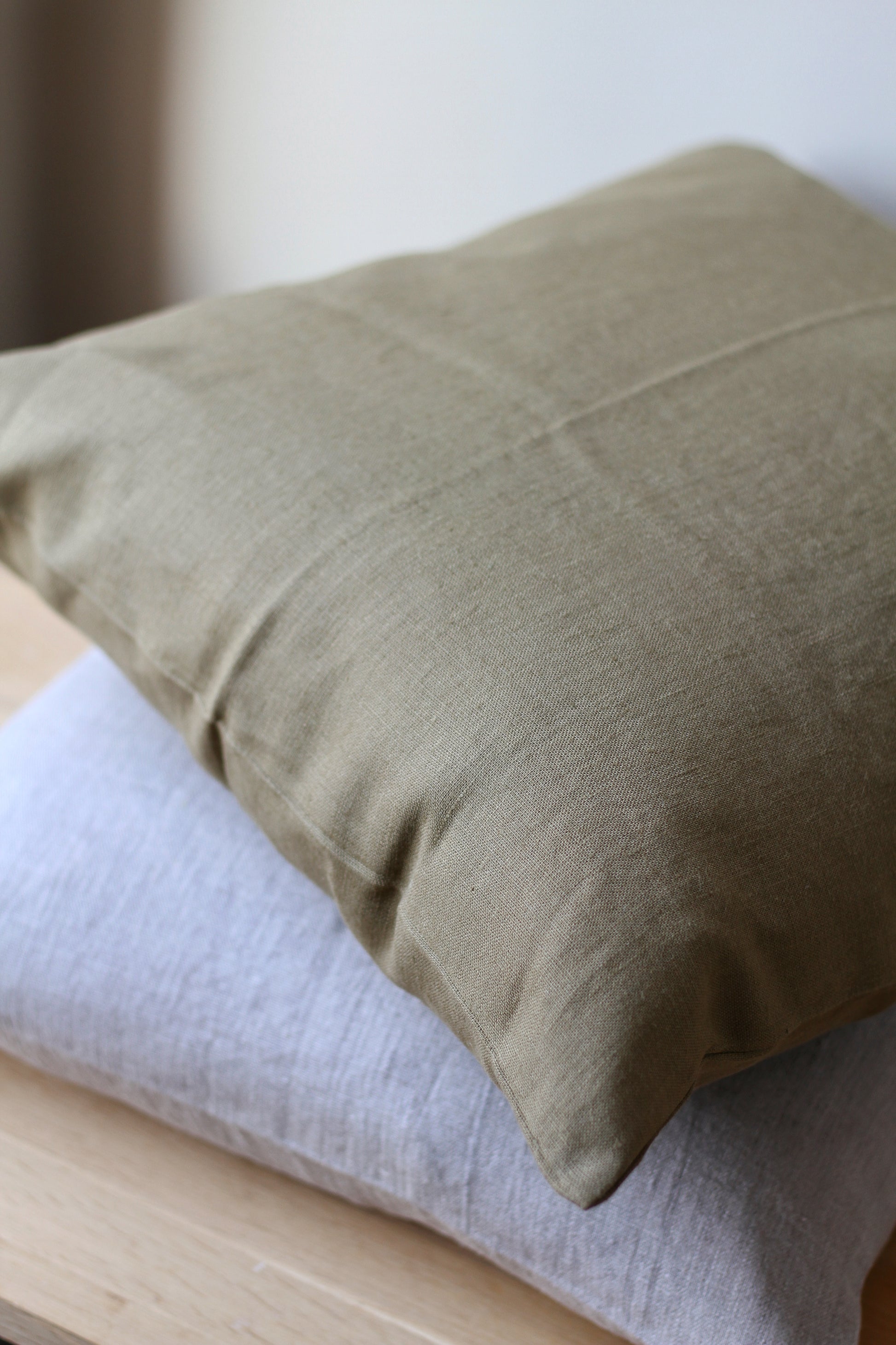 100% linen cushion with feather inner available in olive and natural