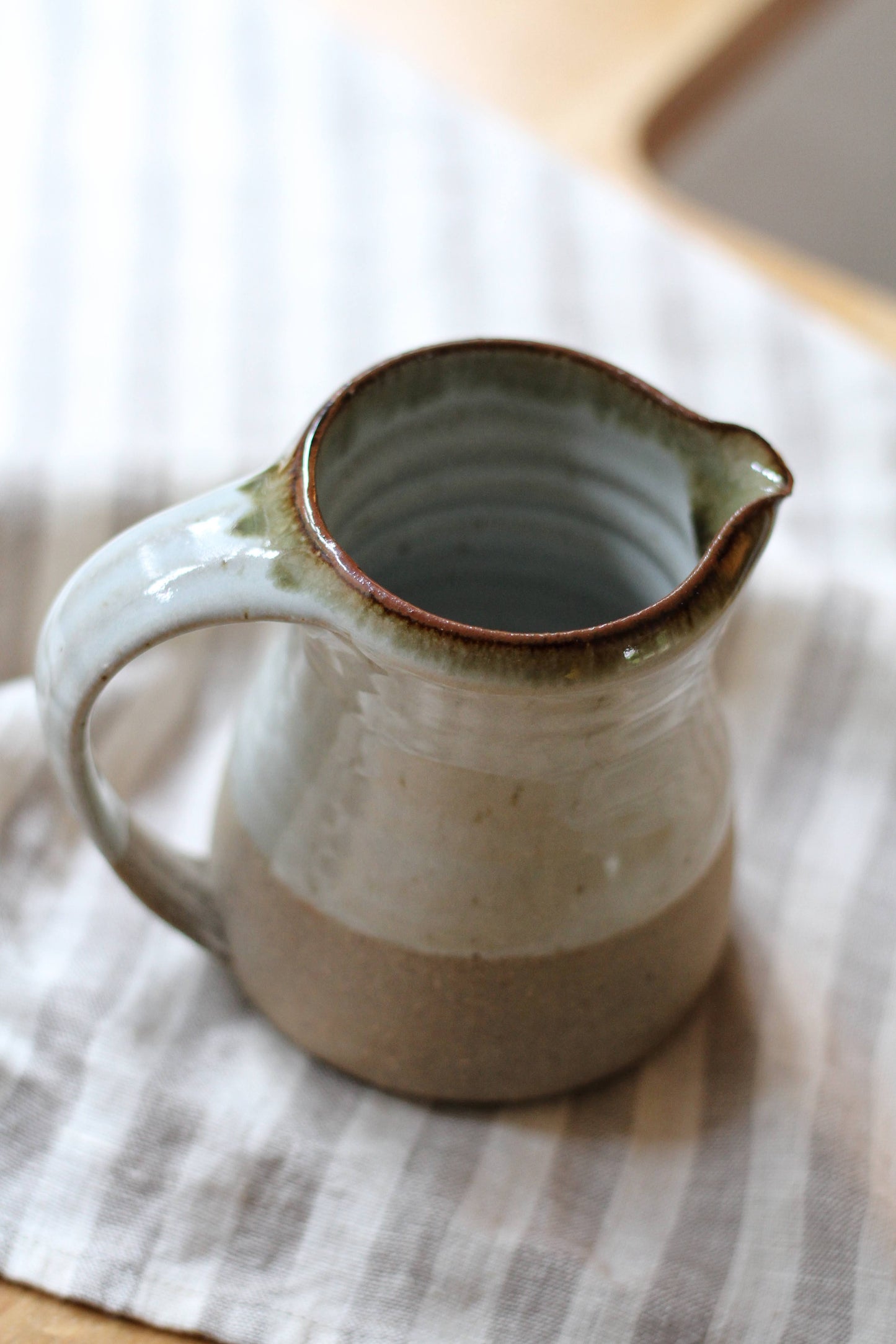 small leach pottery jug in dolomite glaze